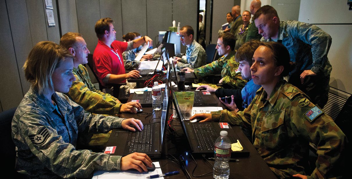 The Red Flag 14-1 cyber protection team works on defense procedures inside the Combined Air and Space Operations Center-Nellis during the exercise February 5, 2014, at Nellis Air Force Base, Nevada. The CPT’s primary goal is to find and thwart potential space, cyberspace, and missile threats against U.S. and allied forces. (U.S. Air Force photo/Senior Airman Brett Clashman)